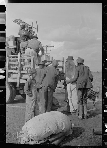 State highway officials moving sharecroppers away from roadside to area between the levee and Mississippi River, New Madrid County, Missouri