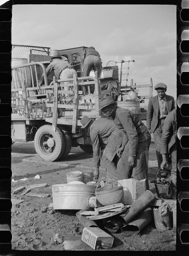 State highway officials moving sharecroppers away from roadside to area between the levee and the Mississippi River, New Madrid County, Missouri