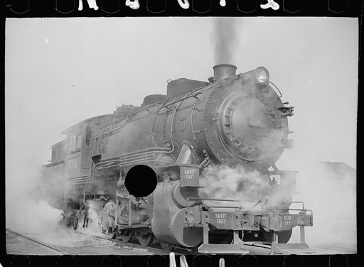 Untitled photo, possibly related to: Locomotive in railroad yards along river, St. Louis, Missouri