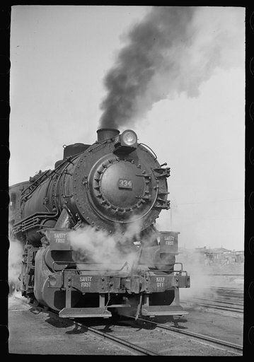 Untitled photo, possibly related to: Locomotive in railroad yards along river, St. Louis, Missouri