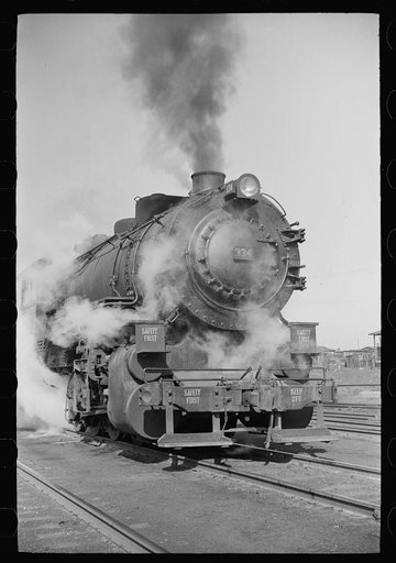 Locomotive in railroad yards along river, St. Louis, Missouri