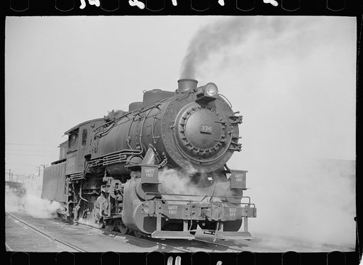 Locomotive in railroad yards along river, St. Louis, Missouri