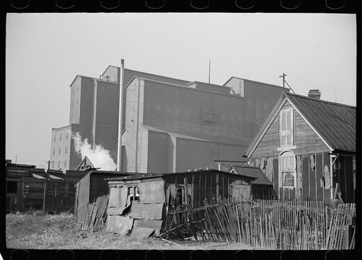Squatters' shacks with grain elevator in background, Saint Louis, Missouri