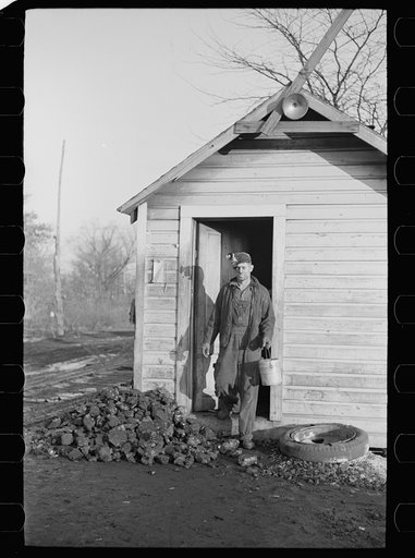 Gopher hole miner checking out at end of day's work. Williamson County, Illinois (see 26940-D)