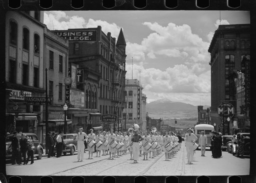 High school band parading up Montana Street, Butte, Montana