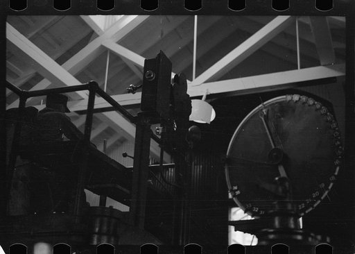 Untitled photo, possibly related to: Engineer at controls of high-speed hoist which reaches depth of 3800 feet. Copper mine, Butte, Montana