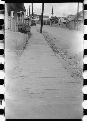 Untitled photo, possibly related to: Board sidewalk on main street. Butte, Montana