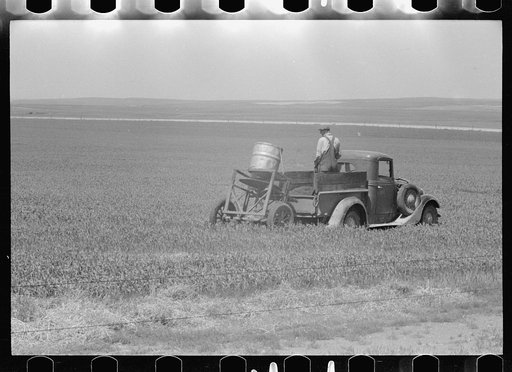 Farmers spreading poison grasshopper bait, Richland County, Montana