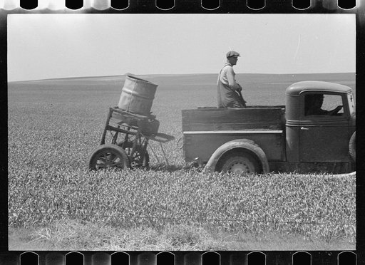 Untitled photo, possibly related to: Farmers spreading poison grasshopper bait, Richland County, Montana
