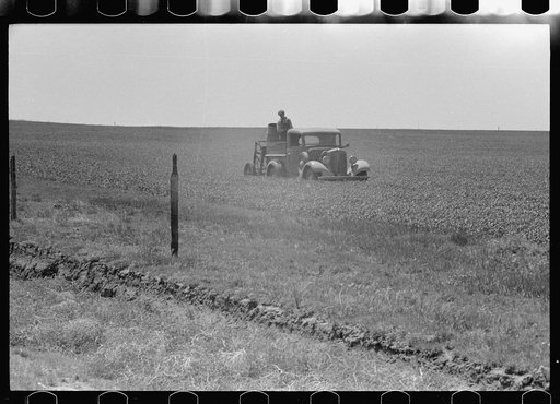Untitled photo, possibly related to: Farmers spreading poison grasshopper bait, Richland County, Montana
