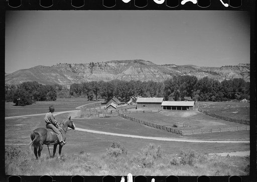 Jack Arnold looking over the Quarter Circle U Ranch which he owns, Rosebud County, Montana