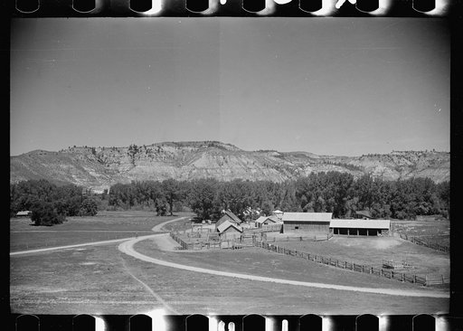 Untitled photo, possibly related to: Jack Arnold looking over the Quarter Circle U Ranch which he owns, Rosebud County, Montana