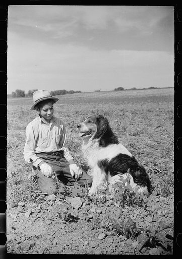 Young sugar beet worker with dog, Treasure County Montana
