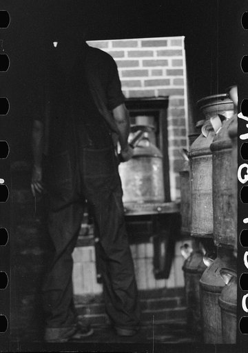 Untitled photo, possibly related to: Unloading a milk truck at pasteurizing plant, Farmington, Minnesota