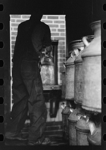 Untitled photo, possibly related to: Unloading a milk truck at pasteurizing plant, Farmington, Minnesota
