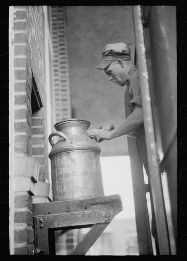 Untitled photo, possibly related to: Unloading a milk truck at pasteurizing plant, Farmington, Minnesota