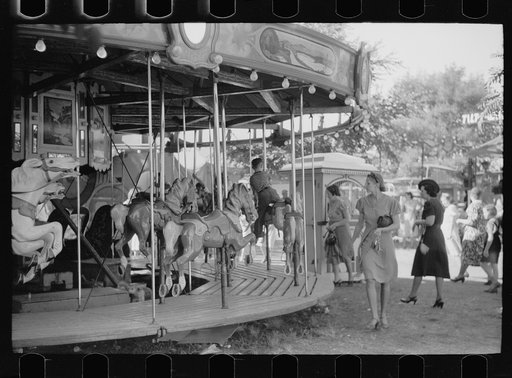 Merry-go-round on midway, Central Iowa 4-H Club fair, Marshalltown, Iowa