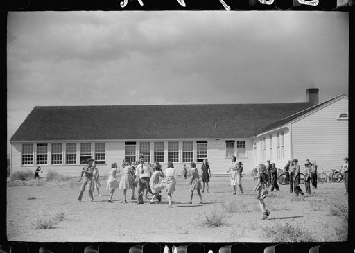 Alamosa (vicinity), Colorado, San Luis Valley Farms. Children of resettlement families playing near the community building in the schoolyard