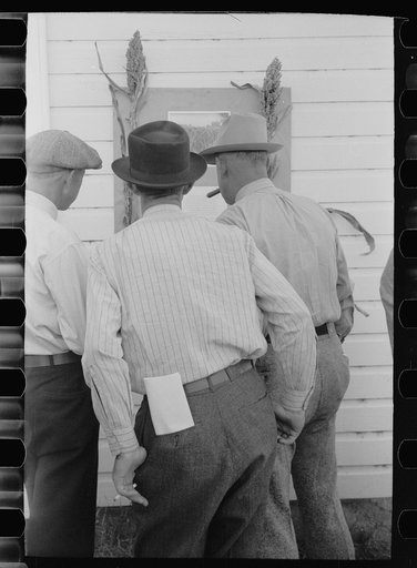 Farmers at sorghum exhibit, U.S. Experiment Station, Akron, Colorado