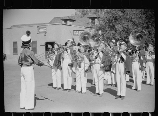 High school band welcomes officials arriving for farmers' field day, Akron, Colorado