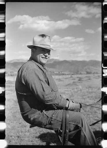 Untitled photo, possibly related to: County supervisor George Stewart (right) discusses farm problems with rehabilitation client Russel D. Glenn in Chaffee County, Colorado