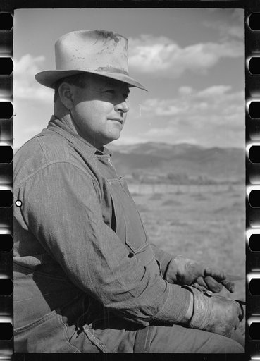 Untitled photo, possibly related to: County supervisor George Stewart (right) discusses farm problems with rehabilitation client Russel D. Glenn in Chaffee County, Colorado
