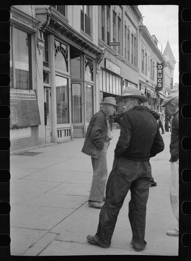 Untitled photo, possibly related to: Men watching World Series baseball scores on main street, Montrose, Colorado