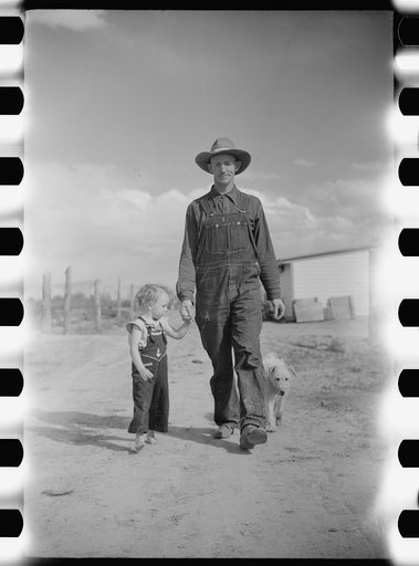 Thomas W. Beede, resettlement client, Western Slope Farms, Colorado poses with his youngest daughter
