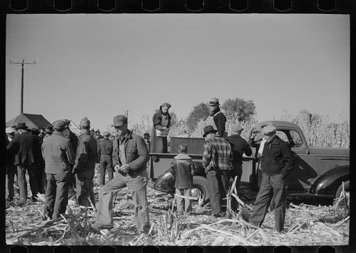 Untitled photo, possibly related to: Farmer and son at refreshment stand, mechanical corn picker contest, Hardin County, Iowa