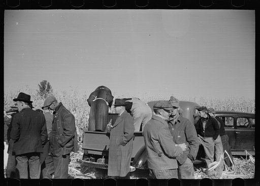 Untitled photo, possibly related to: Farmer and son at refreshment stand, mechanical corn picker contest, Hardin County, Iowa