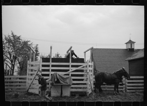 Untitled photo, possibly related to: Wagon with extra-high bangboard used in cornhusking contest, Marshall County, Iowa