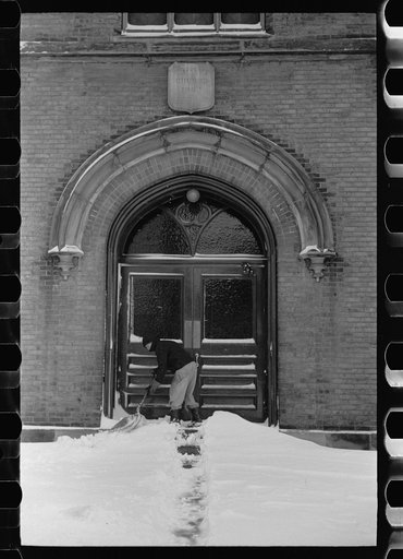 Shoveling snow away from church entrance, Chillicothe, Ohio
