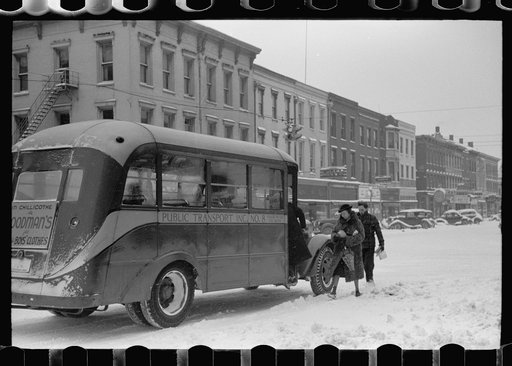 Passengers entering bus during snowstorm, Chillicothe, Ohio