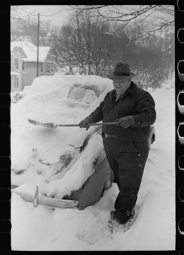 Man cleans off car, Chillicothe, Ohio