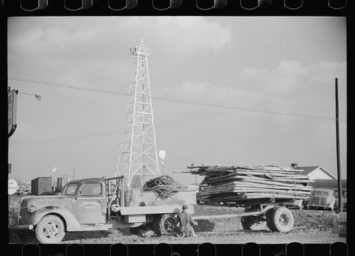 Untitled photo, possibly related to: Truck stuck in the mud of oil field, Marion County, Illinois
