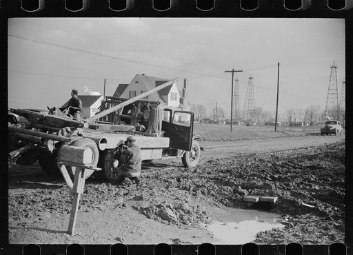 Untitled photo, possibly related to: Truck stuck in the mud of oil field, Marion County, Illinois