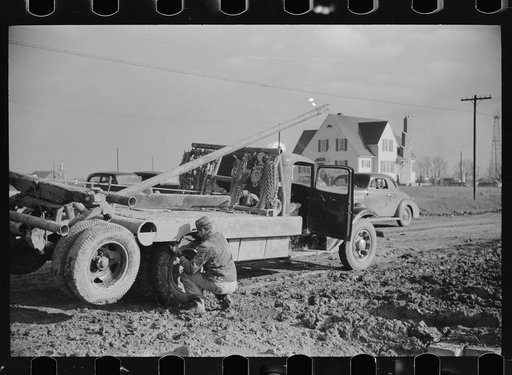 Untitled photo, possibly related to: Truck stuck in the mud of oil field, Marion County, Illinois