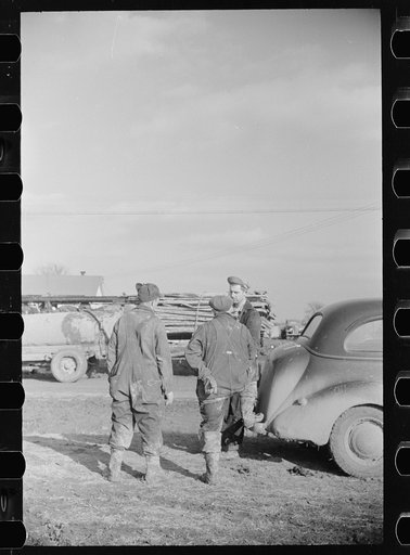Workers in oil field, Marion County, Illinois