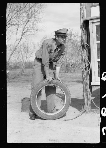 Untitled photo, possibly related to: Migratory worker at coop store gas station, FSA (Farm Security Administration) camp, Weslaco, Texas