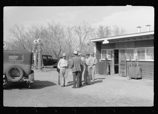 Untitled photo, possibly related to: Migratory worker at coop store gas station, FSA (Farm Security Administration) camp, Weslaco, Texas