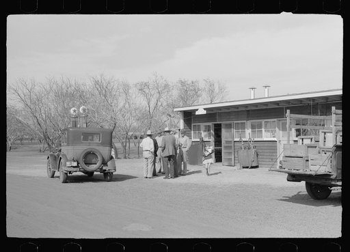 Untitled photo, possibly related to: Migratory worker at coop store gas station, FSA (Farm Security Administration) camp, Weslaco, Texas