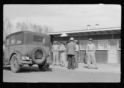 Untitled photo, possibly related to: Migratory worker at coop store gas station, FSA (Farm Security Administration) camp, Weslaco, Texas