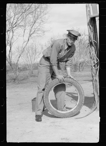 Migratory worker at coop store gas station, FSA (Farm Security Administration) camp, Weslaco, Texas