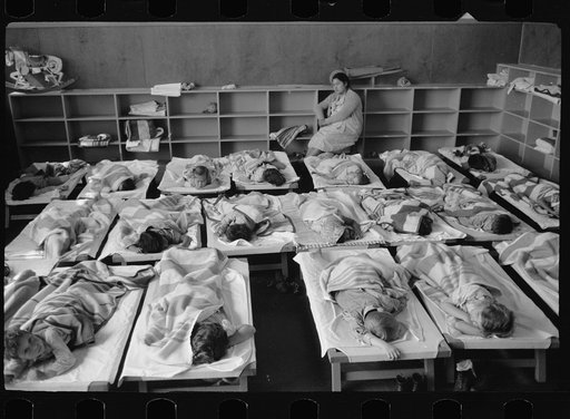 Nursery school, FSA (Farm Security Administration) camp, Harlingen, Texas. Member of mother's committee watches