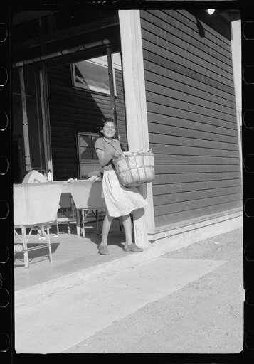 Migratory worker's wife at community laundry, FSA (Farm Security Administration) camp, Sinton, Texas