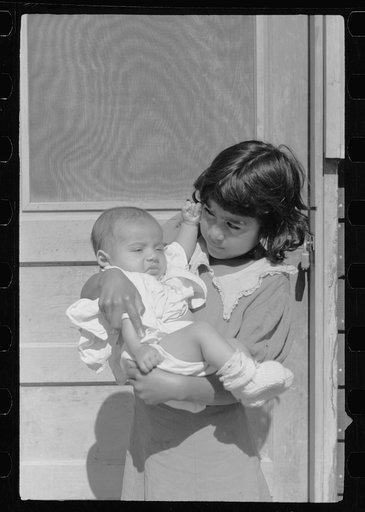 Untitled photo, possibly related to: Migratory worker's child at community store, FSA (Farm Security Administration) camp, Sinton, Texas