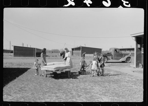 Untitled photo, possibly related to: In front of the community store, FSA (Farm Security Administration) camp, Sinton, Texas