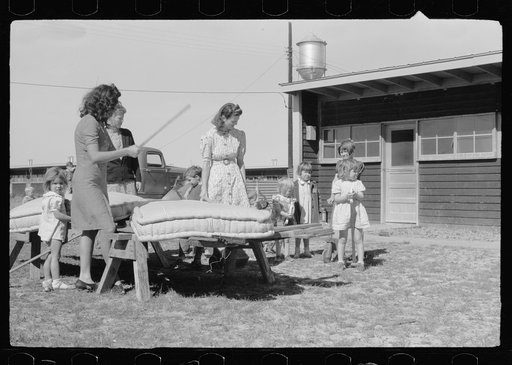 Untitled photo, possibly related to: In front of the community store, FSA (Farm Security Administration) camp, Sinton, Texas