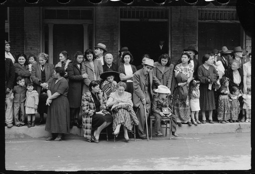 Crowds watching children's parade, part of Charro Days celebration, Brownsville, Texas. Children from the schools in Matamoras, Mexico and from the Brownsville schools participated jointly