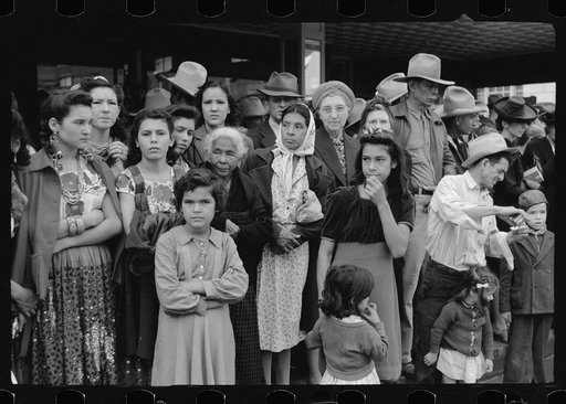 Crowds watching children's parade, part of Charro Days celebration, Brownsville, Texas. Children from the schools in Matamoras, Mexico and from the Brownsville schools participated jointly